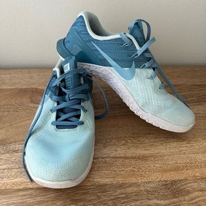 Blue Nike metcons woman